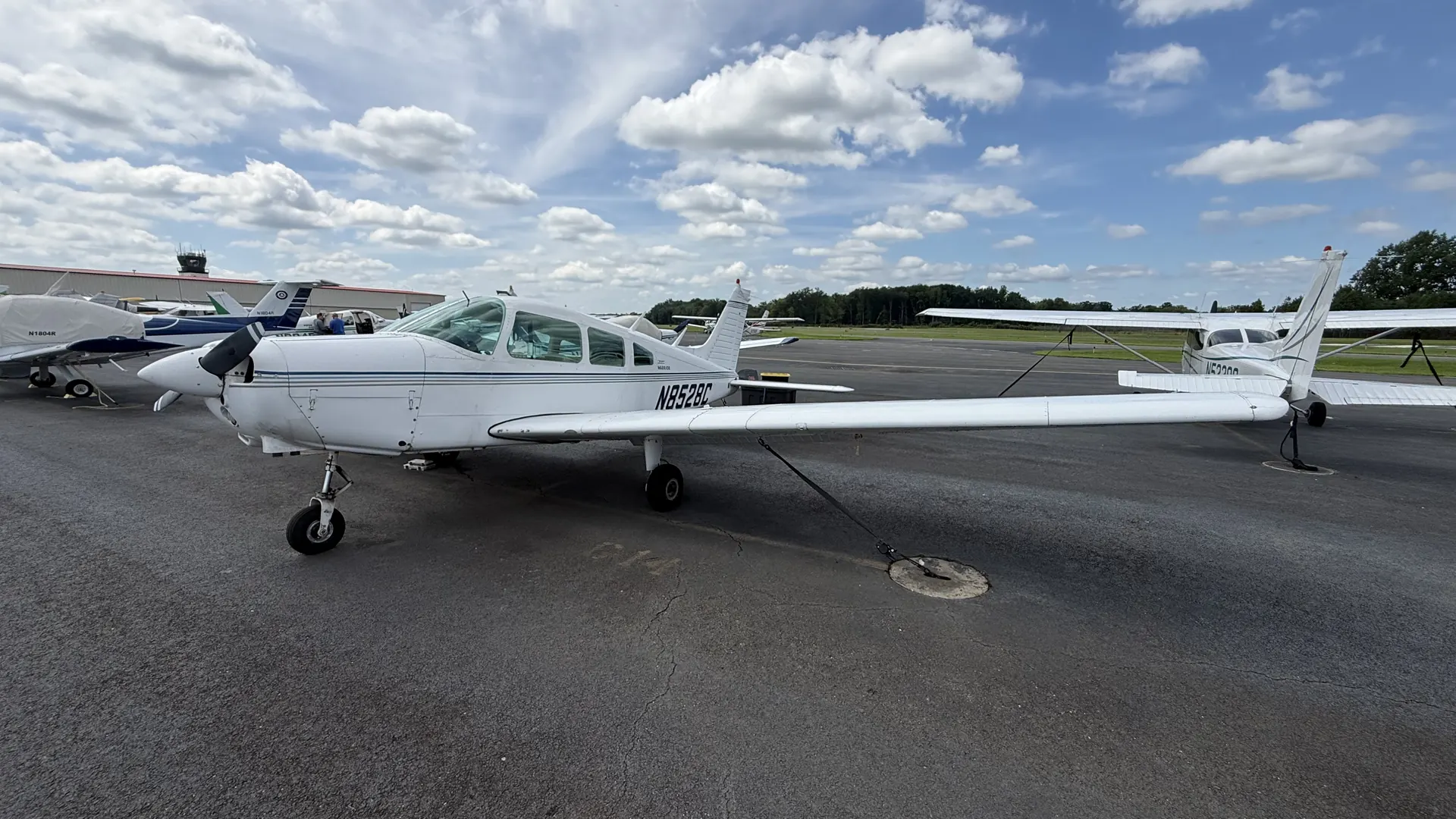 The Warrior from the left side, showing the full length of the fuselage and the low wing.