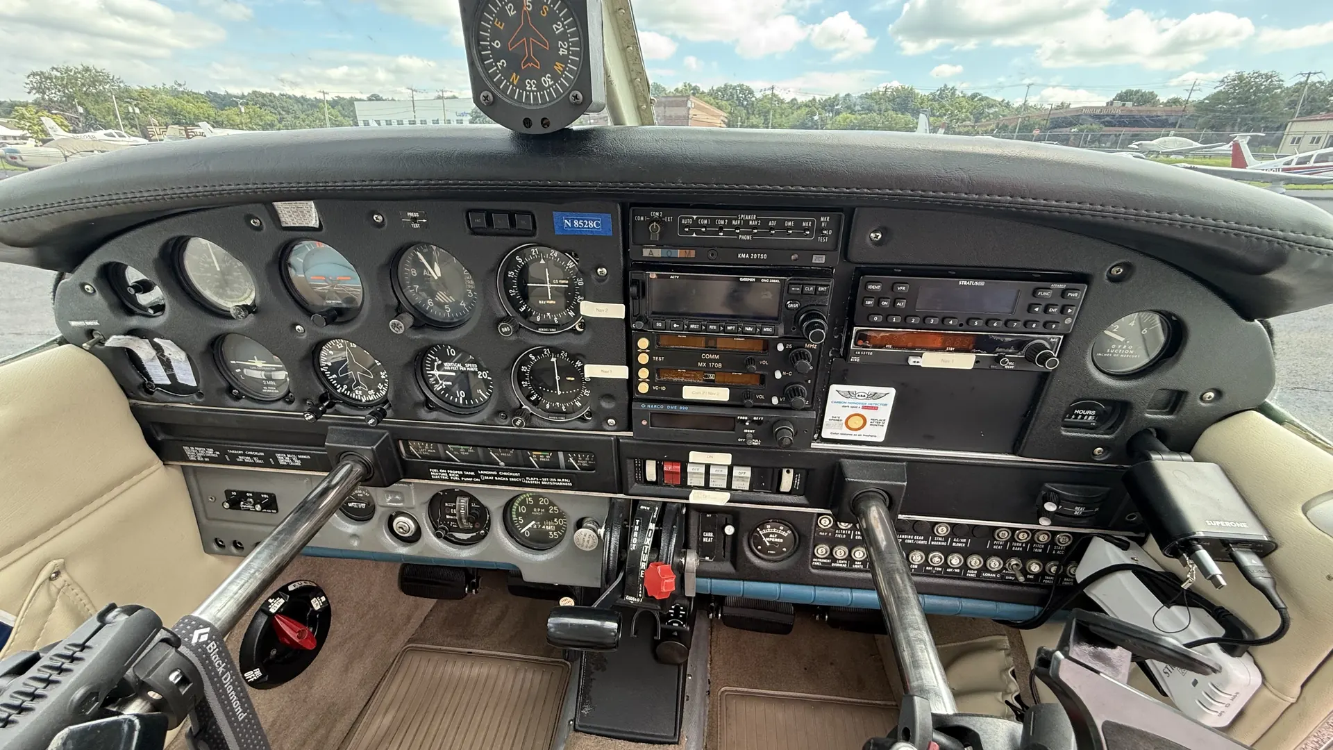 The full instrument panel of the Warrior, with flight instruments on the left and the radio stack in the centre.