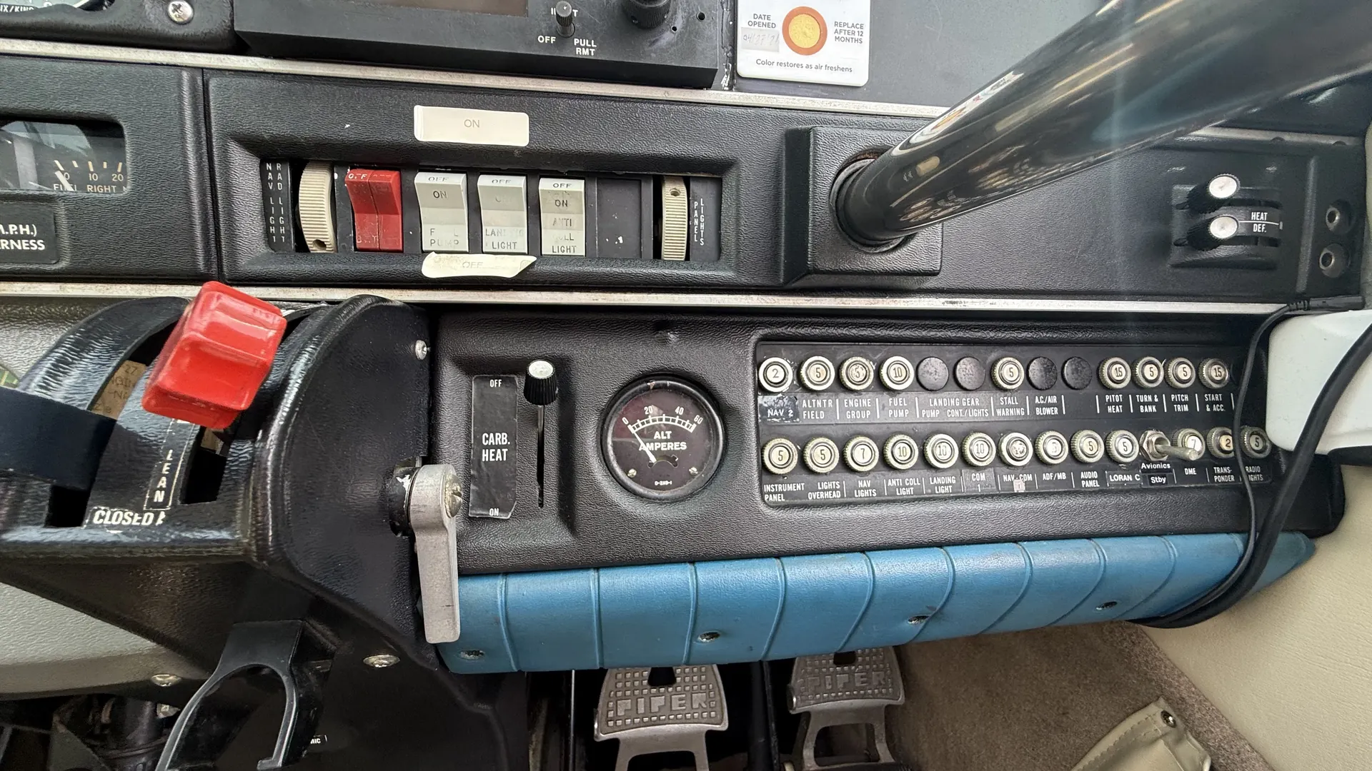 The switch panel and circuit breaker row along the lower right of the panel.