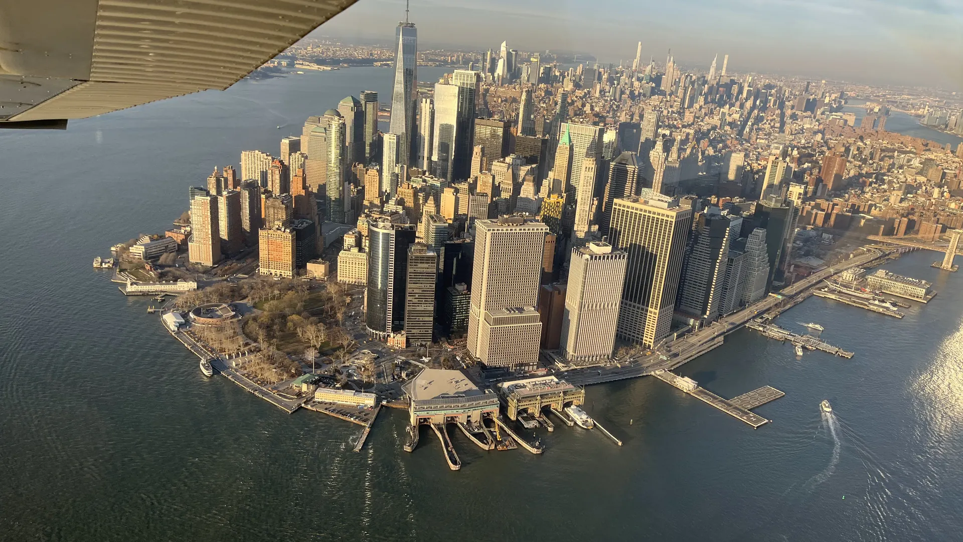Lower Manhattan from the air on a clear afternoon, seen past the wing of a
light aircraft.